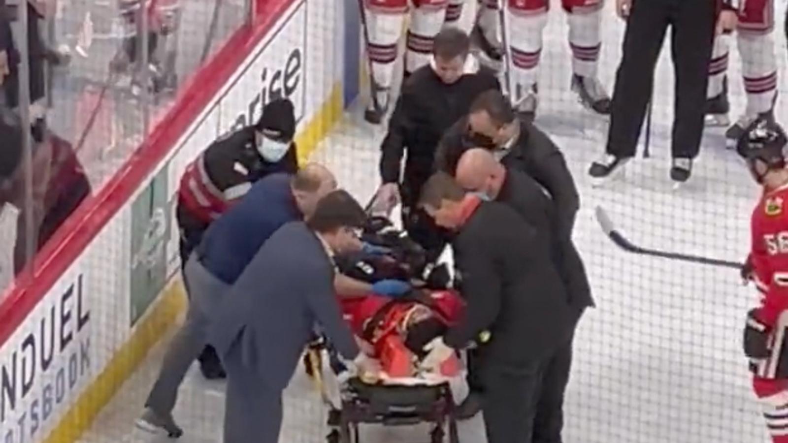 Jujhar Khaira lays motionless on the ice after massive hit, taken out on stretcher