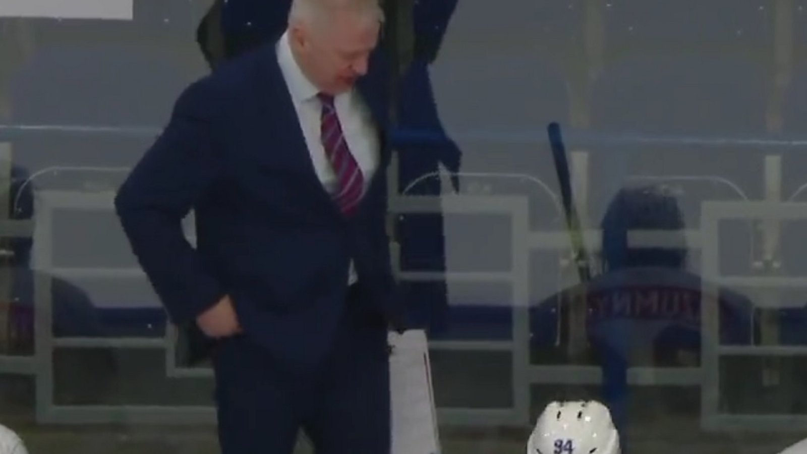 Russian coach fired after kicking a player on the bench.