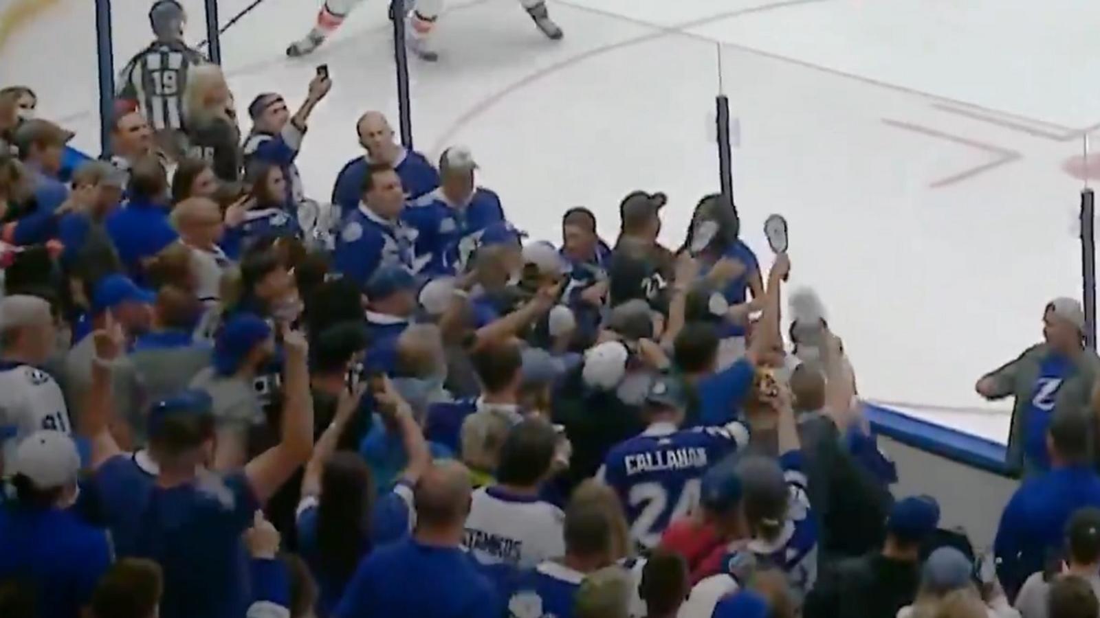 Brawl breaks out between fans in the crowd for Game 7.